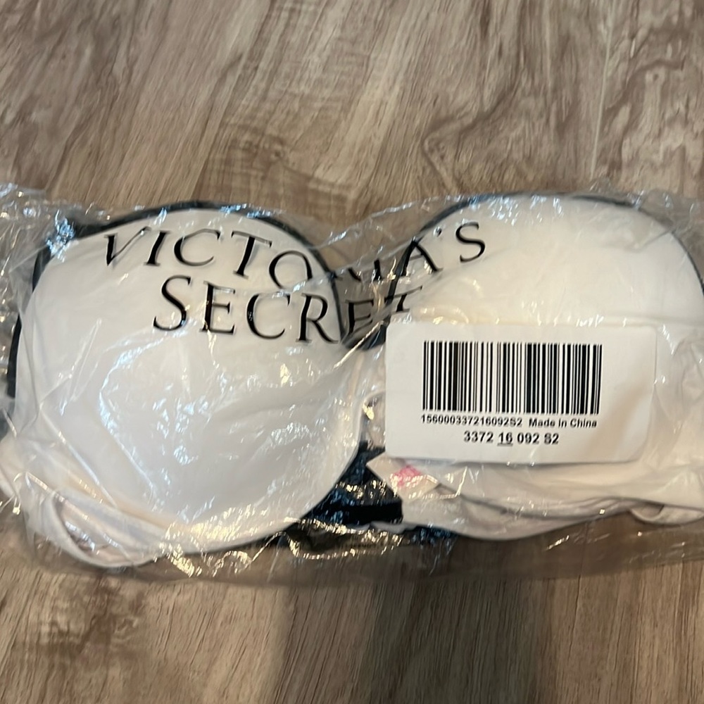 NWT Victoria’s Secret, pink, sports bra, white and black trim. 32DD